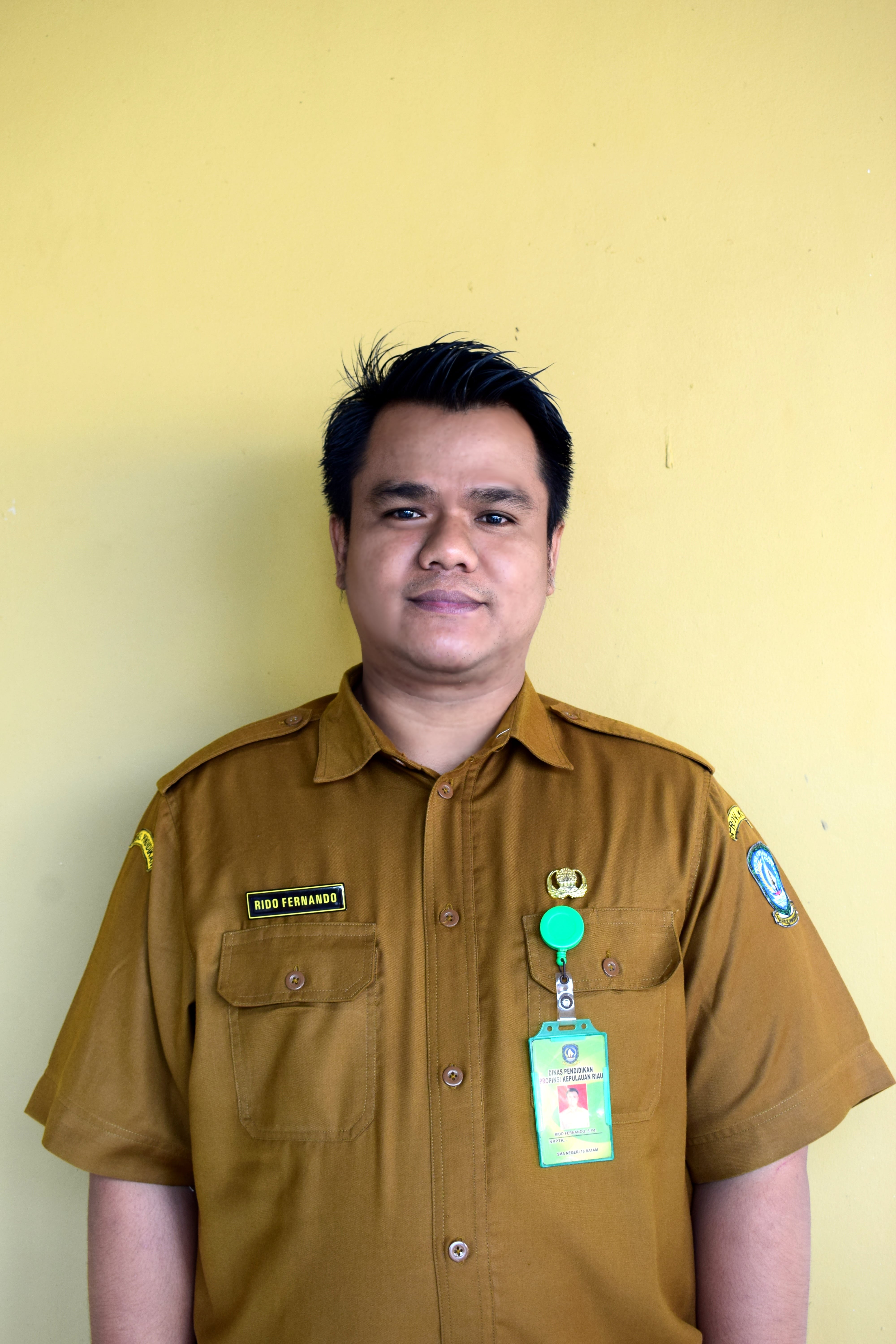 RIDO FERNANDO, S.Pd